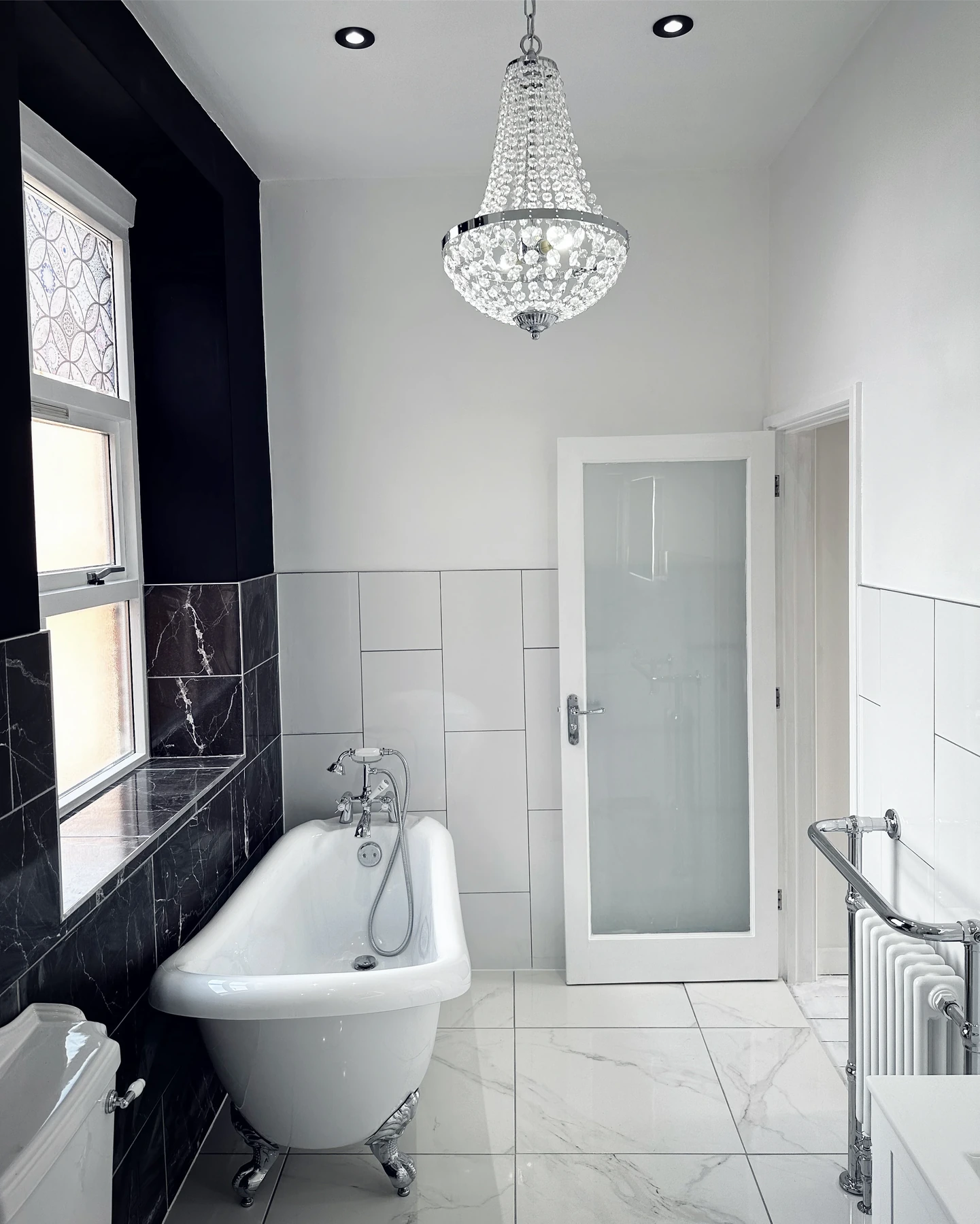 Full bathroom renovation with freestanding bath and LED lighting