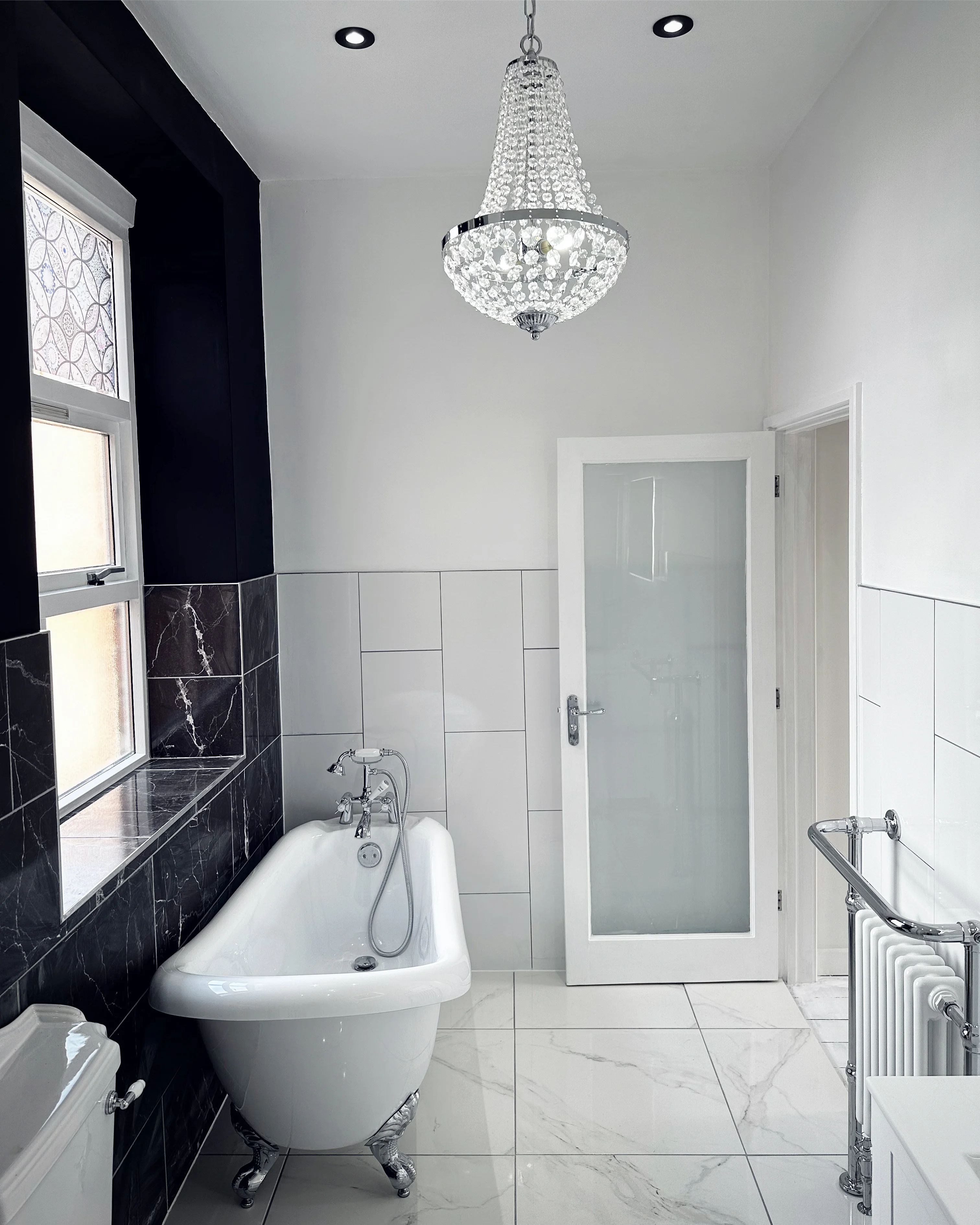 Full bathroom renovation with freestanding bath and LED lighting