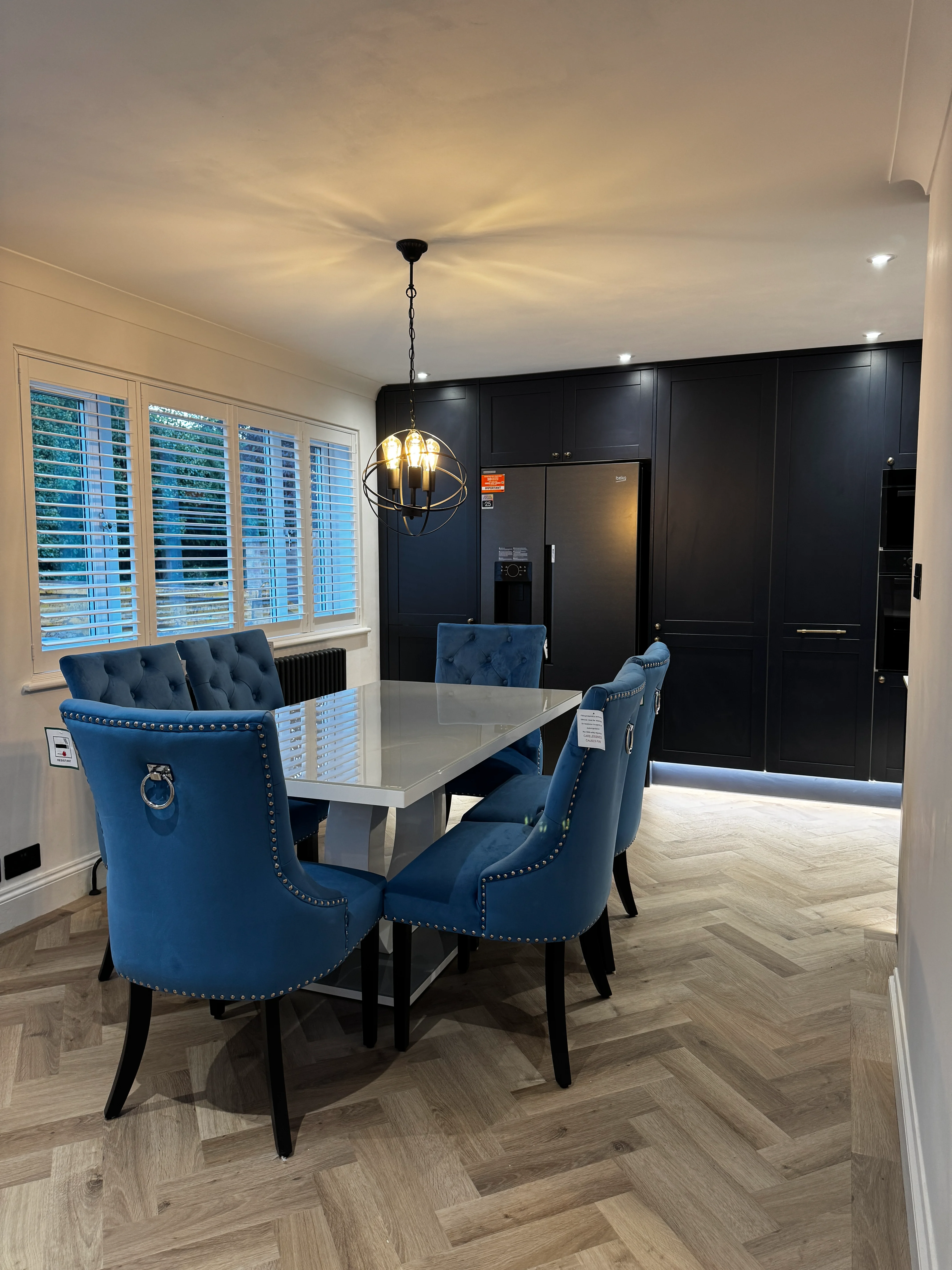 Luxury kitchen renovation with quartz island and pendant lighting by Entigen