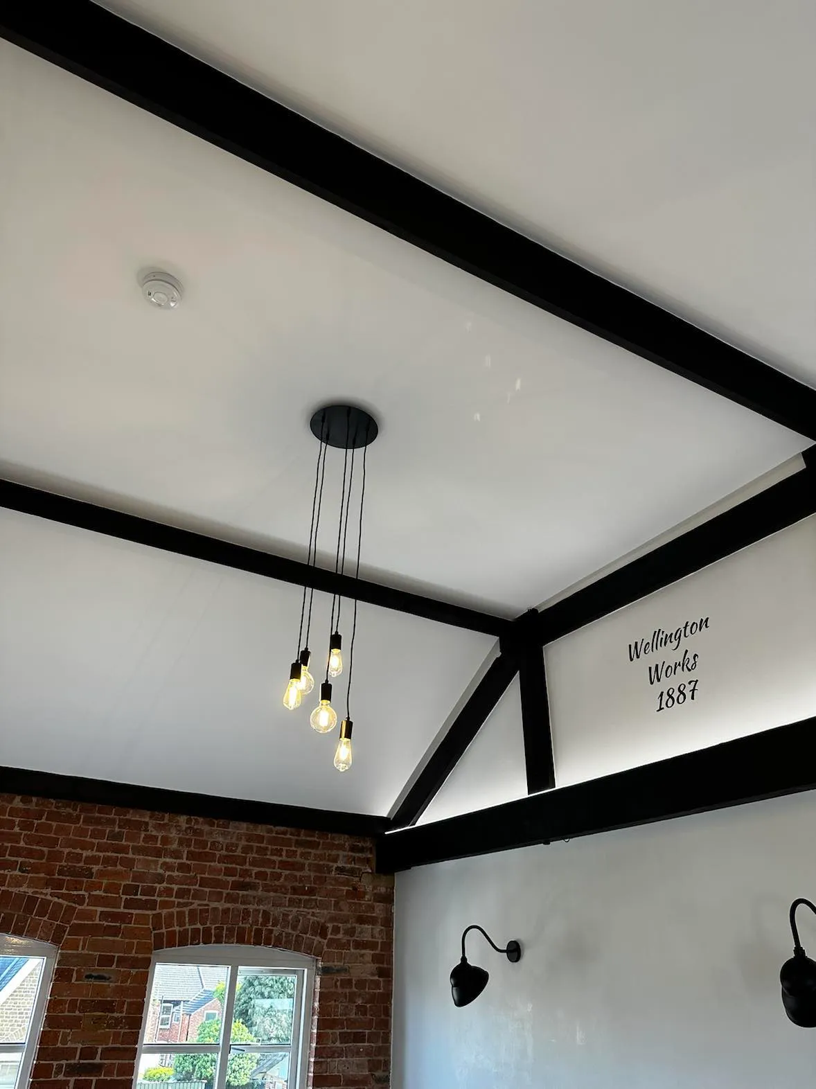 Renovated landing with recessed downlight and framed artwork