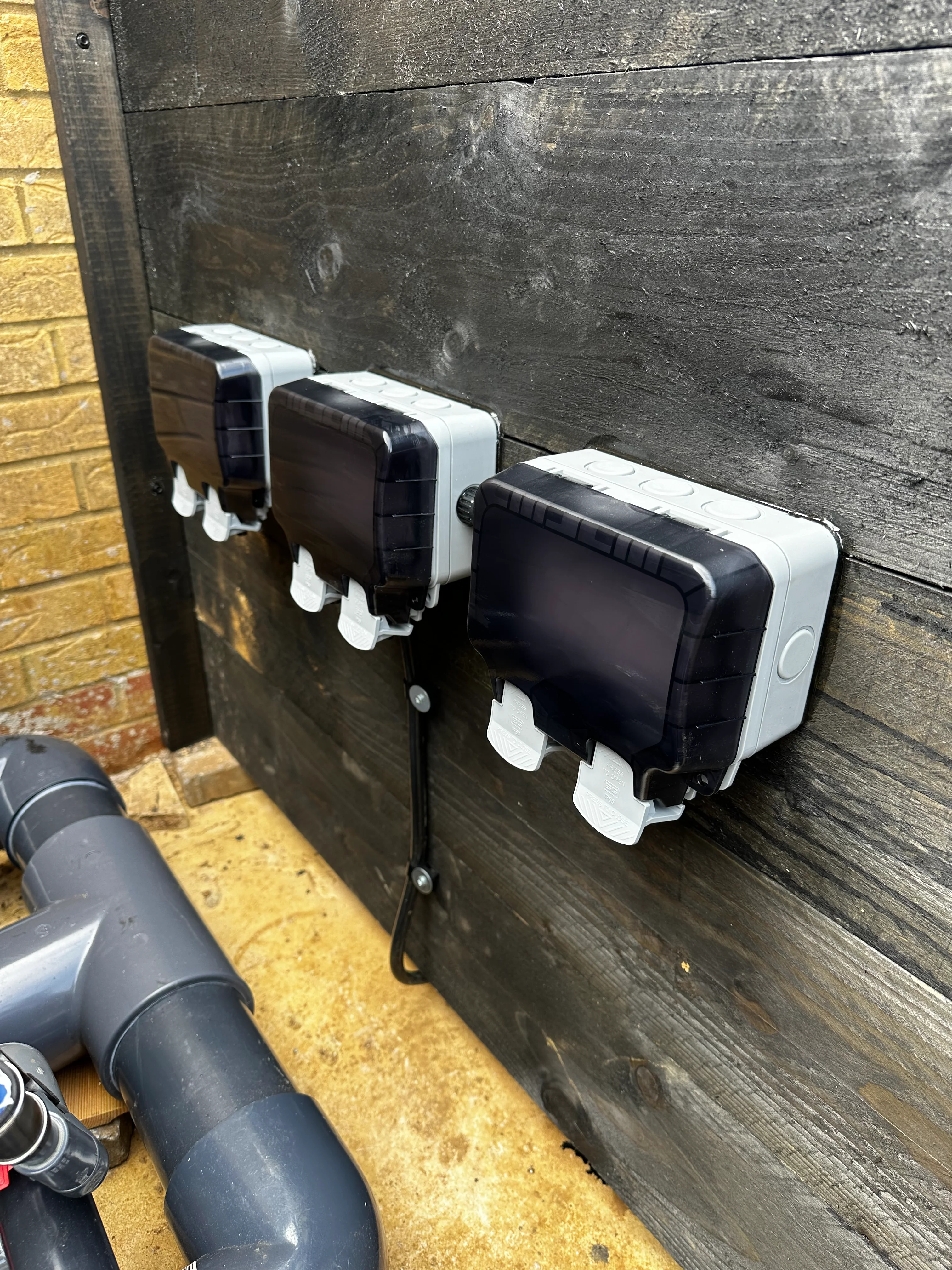 Electrician checking socket wiring terminals for loose connections in Kettering